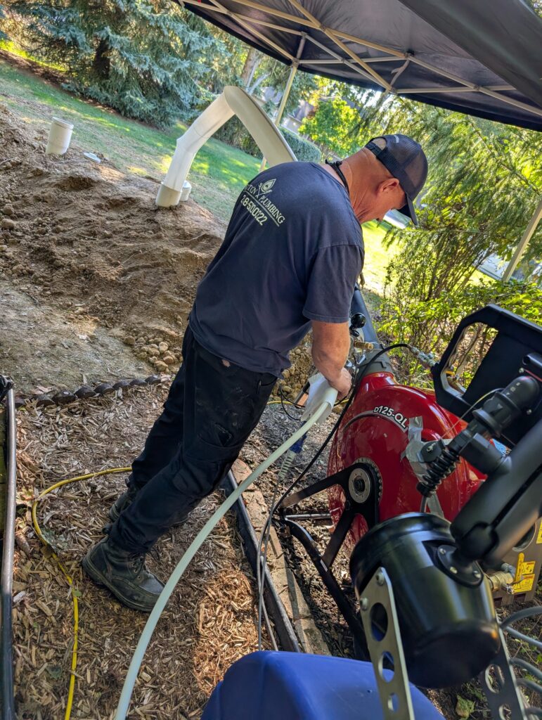 A Triton Plumbing tech performs trenchless sewer repair